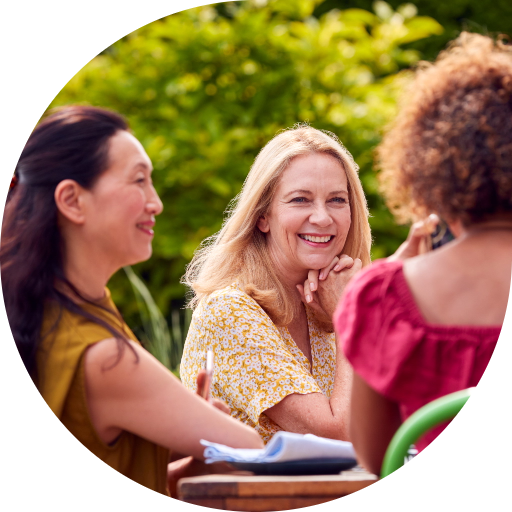group-of-mature-female-friends-talking-around-tabl-2024-10-19-07-21-03-utc